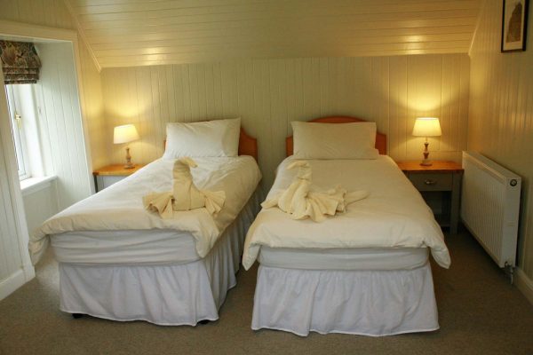 Comfortable twin bedroom setup at Duart Cottage Glencoe