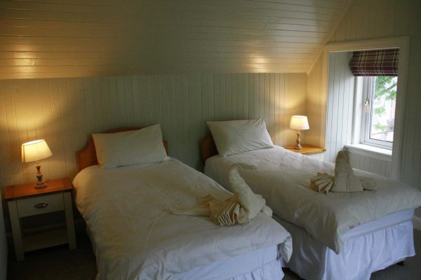 Comfortable twin bedroom setup at Duart Cottage Glencoe
