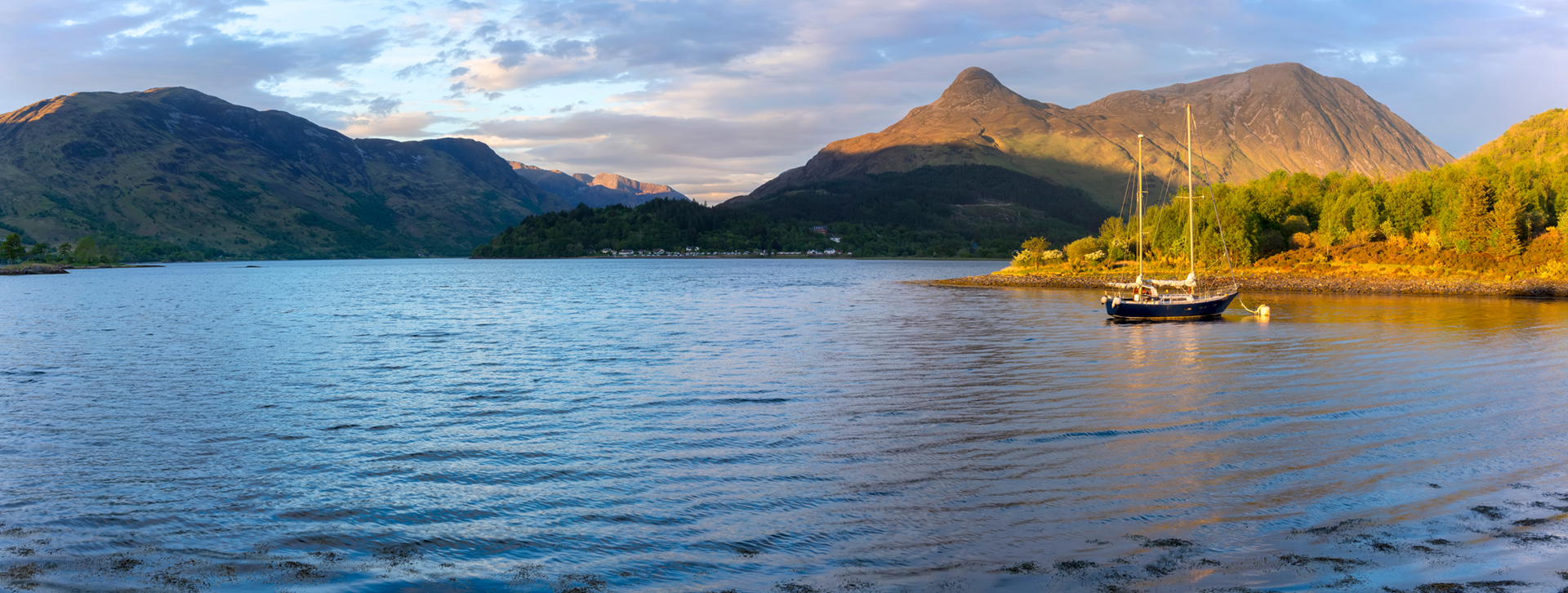 Panorama of Pap of Glencoe and surrounding Scottish Highlands landscape