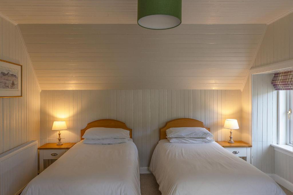 Comfortable twin bedroom setup at Duart Cottage Glencoe