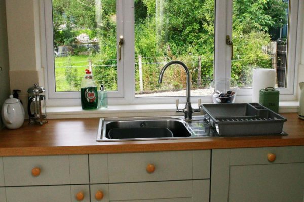 Fully equipped open plan kitchen and dining table setup for 6 guests