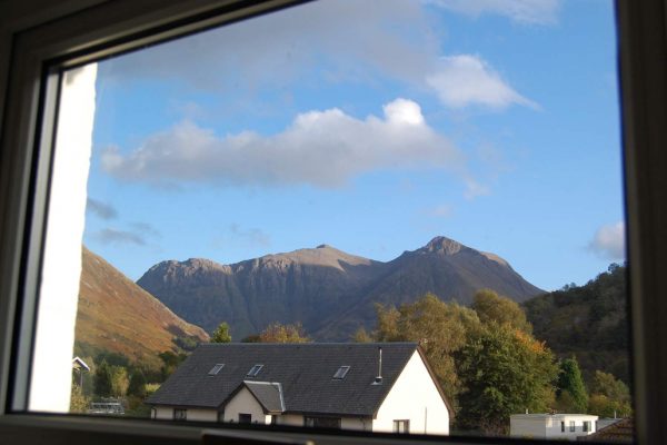 Duart Cottage window view of Pap of Glencoe and surrounding Scottish Highlands